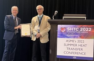 John Lienhard receiving the Kern Award plaque from Joel Plawsky.